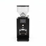 Close-up of a black countertop coffee grinder with a digital display screen showing '9.3 g' and 'INSERT', plus a stainless steel portafilter holder and bean hopper.