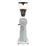 A white electric coffee grinder with a clear bean hopper filled with coffee beans, shown against a plain white background.