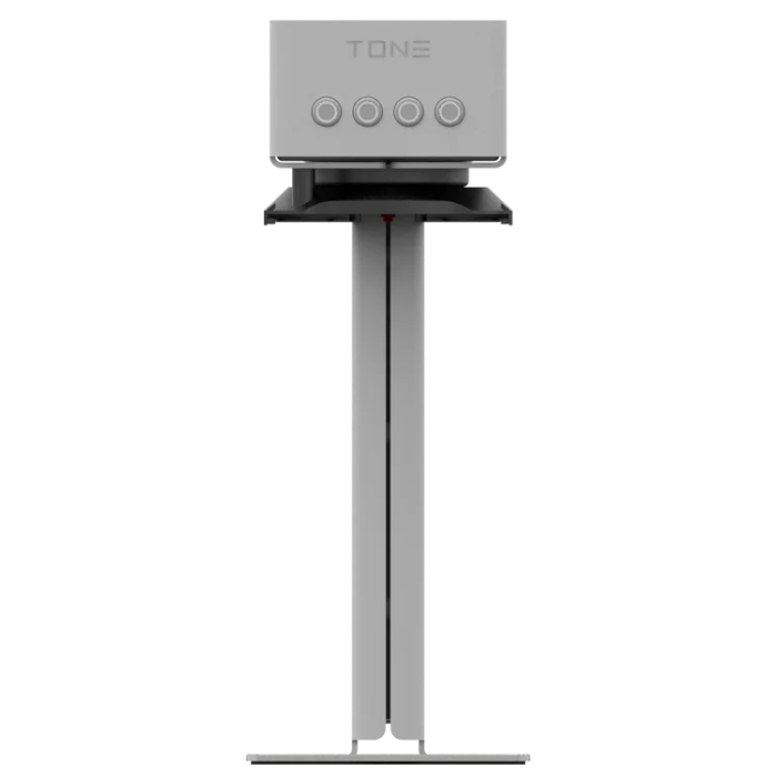 A modern TONE coffee brewer device on a slim black stand, shown against a solid white background.