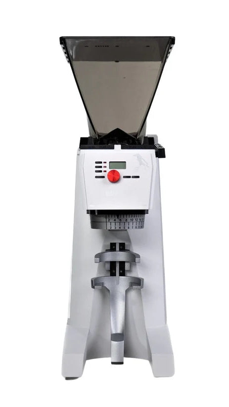 A compact electric grinder with a white body, black hopper, and silver metal components, featuring a red emergency stop button on the front panel.