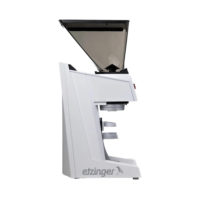 White coffee grinder with black top on a white background, featuring the etzinger brand.