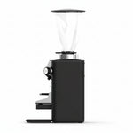 Black coffee grinder with glass container on a white background